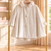 Ivory Ruffle off-white παλτό βάπτισης κοριτσιού με κουκούλα και ριχτές μανσέτες